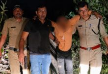 Police personnel arrest accused after an encounter in the Rishikesh villager shooting case.