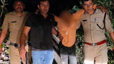 Police personnel arrest accused after an encounter in the Rishikesh villager shooting case.
