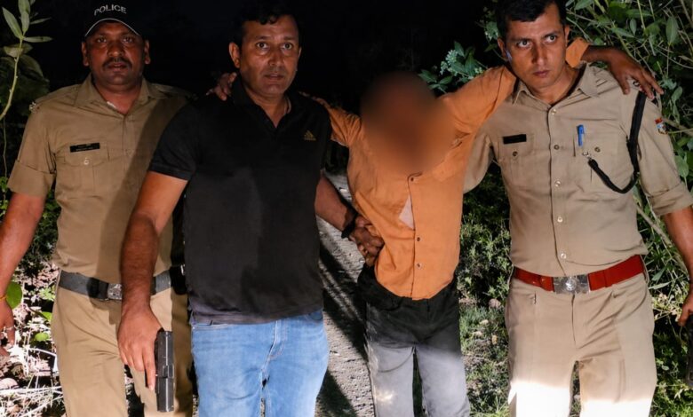 Police personnel arrest accused after an encounter in the Rishikesh villager shooting case.